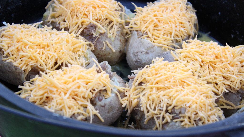 Sprinkle Cheese on the Top of Each Potato Boat